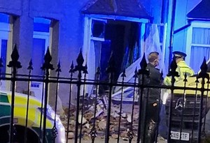 Car crashes into house