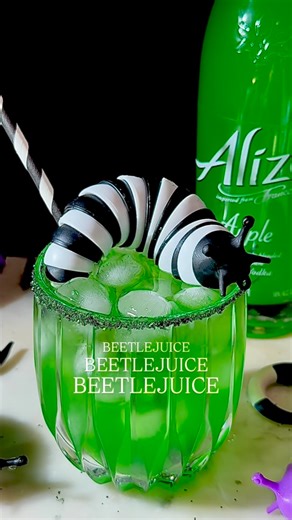 Marvelous Mixing on Instagram: "Say it three times and sip if you dare! The hauntingly good Alizé Apple Vodka liqueur is crisp, fruity, and dangerously smooth. One taste and you’ll be calling for another. Alizé is imported from France and has 11 different flavors. All flavors are unique, all natural, premium liqueurs with 16% ABV. Apple might just be my new favorite! #alizépartner Beetlejuice, Beetlejuice, Beetlejuice ⚫️2 oz Alizé Apple French Vodka Liqueur ⚪️1 oz vodka ⚫️0.75 oz simple syrup ⚪️