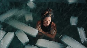 Healthy Woman Diving into Cold Water of Swimming Pool with Ice Cubes for Good Body Health. Strong Person in Bathtub Full of Chilly Aqua for Plunge. Extreme Training of One Healthy Lady Using Icy Bath
