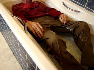 FULLY CLOTHED IN THE BATH