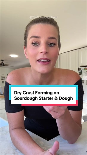 Why Does Your Sourdough Starter or Dough Get a Crust on Top? That “skin” is usually caused by too much exposure to air. ✨ Common reasons: • Low humidity • Warm room temps • Loose lids or uncovered dough ✅ Easy fixes: DRY ENVIRONMENT: • Use a plastic shower cap or plastic wrap (for dough) • Use a metal or glass lid (for starter) HUMID ENVIRONMENT: • Use a kitchen towel (for dough) • Use a metal or glass lid (for starter) Totally normal and totally fixable 💛 #sourdough #sourdoughstarter #sourdoug