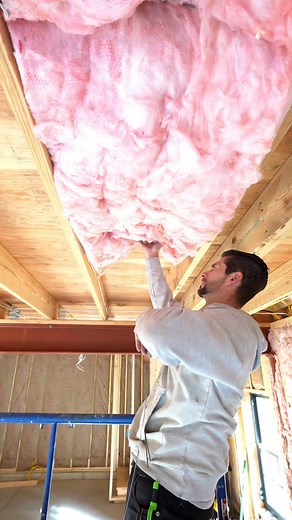 Pro Tip #24 how to use insulation support wire so that way you're unfaced insulation doesn't fall out while you're installing it! #carpentrytips #construction #contractor #tipsandtricks #HomeImprovement #hacks #carpentry #builder #deck #tools #diy #fblifestyle | Your Favorite Contractor