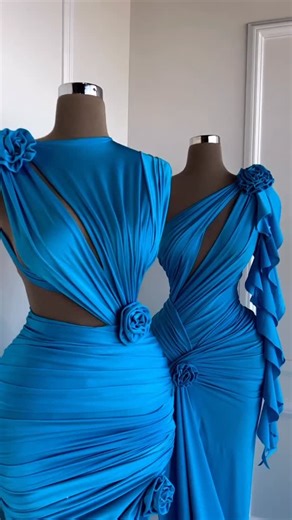 Reinee Couture| Luxury Custom Made Dresses on Instagram: "Share with a friend who would own the spotlight in these electric blue draped gowns! To order, send us a DM at @reineecouture. These electric blue gowns are sculpted on a structured corset base, designed to define the waist while creating a fluid, body-contouring silhouette. Hand-draped fabric flows across the bodice and hips, forming soft ruching that enhances curves with an elegant, architectural effect. Delicate floral accents anchor t
