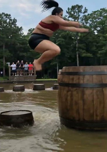 She Jumped Across Barrels That Kept Getting Bigger Over Crocodiles 🐊 #CrocodileChallenge#BarrelJump