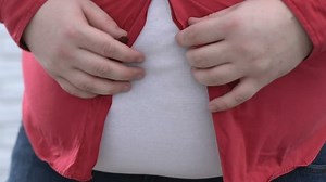 clip-1011221138-big-belly-man-buttoning-red-shirt-pulling