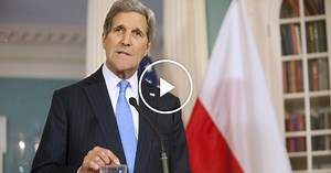 In Two Languages, Kerry Condemns Attack