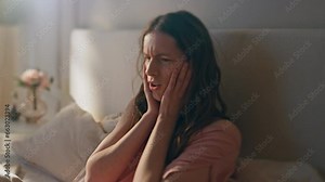 Dizzy girl feeling headache in morning closeup. Frustrated woman suffer hangover