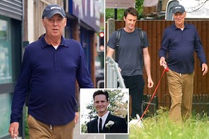 Barrymore smiles on walk after being quizzed over pool death of Stuart Lubbock