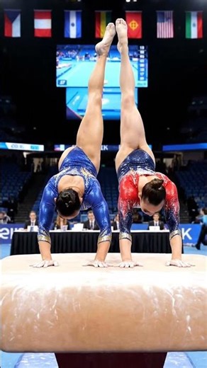 Two Gymnasts Drop into a Straddle Split on the Vault