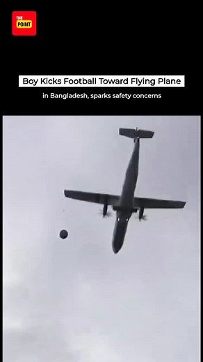 READ | Boy Kicks Football Toward Flying Plane in Bangladesh A shocking video has surfaced from Bangladesh showing a boy kicking a football towards a low-flying plane, with the ball appearing to narrowly miss the aircraft. The footage has gone viral on social media, raising questions about airspace safety near populated areas. Further details about the incident are still awaited. #flyingplane #football | The Point