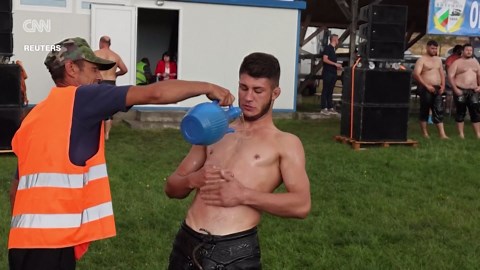Watch: Oil wrestlers slide to victory