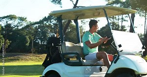 Golfer driving in his golf buggy at golf course 4k
