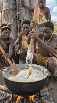 Hadzabe tribe bushman cooking plenty fufu with the okra soup and meat