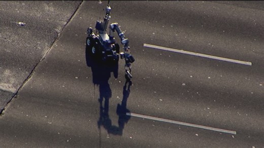 A robot can be seen removing the "suspicious item" from the interstate. | 11Alive