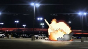 Car Bomb Explosion on Parking Lot Garage at Dusk Zoom In VFX, 4K