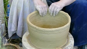 artisan hand making clay pot. Man working on pottery