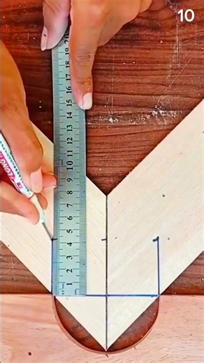 Ruler guides semicircle sketch—sawdust-dusted hand geometry on pale wood for crafted symmetry.