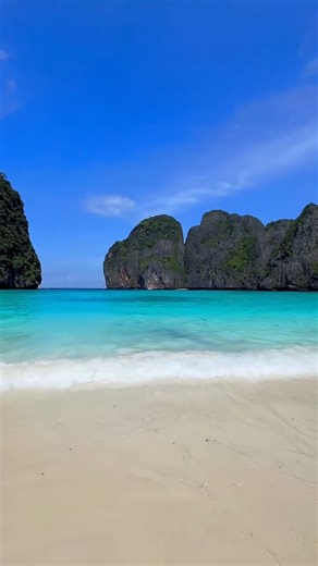 Banyan Tree Holidays | ✨ Maya Bay, Thailand ✨ A slice of paradise where towering limestone cliffs embrace turquoise waters and soft white sands. 🌊🏝️ Famous from... | Instagram