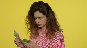 Free stock video - Upset woman counting cash money