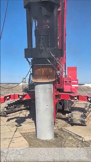The process of driving concrete piles using a hydraulic diesel pile hammer.