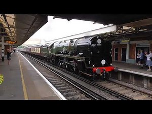 SR Merchant Navy 35028 'Clan Line' at Woking Railway Station with 'The End of Southern Steam'