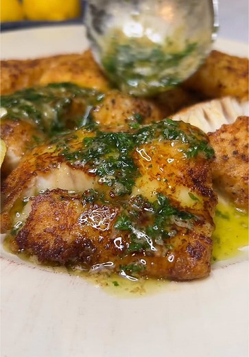 Pan Fried Cod Recipe! This Easy Pan Fried Cod with Lemon Butter Sauce Recipe is a delicious, easy and healthy dinner that can be on your table in 15 minutes!!! Tender, flaky cod is gently coated in seasoned flour, then pan seared to create a most perfect crust. A buttery, lemon sauce only takes minutes to prepare and is the perfect compliment to any white fish. #cod #fish #fishrecipe #easydinner #quickdinner #foodrecipe #feastofthesevenfishes #fishtok #viralrecipe