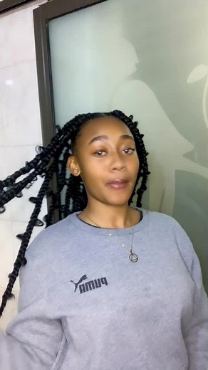 Person with Braided Hair and PUMA Sweatshirt