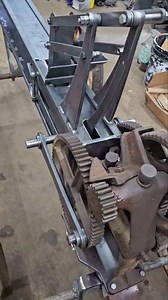 Built completely from scratch. This miniature hay press is my own design, driven by a flat belt for a hit-and-miss engine. The core started as a deep-well pump jack — everything else was fabricated by hand. This clip is the very first time I hooked it up and watched it spin over, just to prove the geometry and ratios were right. Still mid-fabrication, but seeing it turn for the first time is always the moment you know a build is going to work. #crankincramers #hitandmissengine #flatbeltpower #an