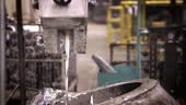 Aluminium melting, operator work hard tapping molten metal from ladle...