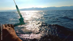 Kite surfing training workout in sunset, surf beginner learning to do maneuvers with heavy kite riding on water, extreme sport recreation. Kite surfer feeling freedom riding on water