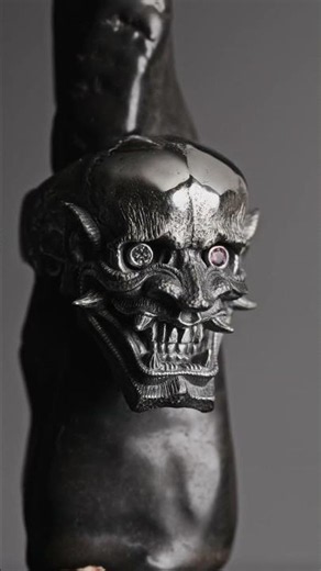 Hannya Ring. Set with a lab-grown diamond and a rhodolite garnet.#hannya #skull #silverjewelry