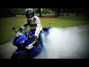 Chick does burnout on motorcycle
