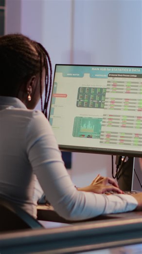 Woman Analyzing Stock Market Data on Computer | Premium Stock Video Footage