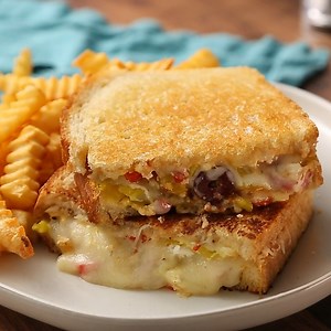 It’s National Grilled Cheese Sandwich Day! Instead of sticking with the classic grilled cheese, make yourself a Greek Grilled Cheese sandwich by melting Odyssey feta cheese on sourdough bread with mozzarella, roasted red peppers, kalamata olives and red onions. 🍞🧀🫑🫒🧅 Here's our recipe >> https://bit.ly/3LVBmfp | Odyssey Brands