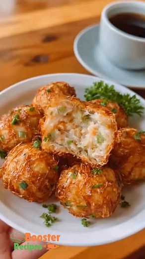 Crispy on the outside and tender inside, these shrimp balls bring the taste of your favorite dim sum spot right to your kitchen. Perfect for sharing with family or as a fun weekend snack that everyone can grab and dip. Ingredients: 1 (12-ounce) package wonton wrappers 2 pounds raw shrimp, peeled and deveined 1/4 cup chopped green onions, plus more for garnish 1 tablespoon soy sauce 1 tablespoon fish sauce 1 teaspoon kosher salt 1 teaspoon freshly ground black pepper 1 teaspoon sugar 1 large egg 