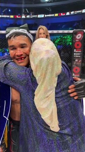 Tyson celebrates his victory with his mother