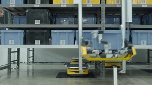 Demonstration of Automated Retail Warehouse AGV Robots Delivering distribution product stock on shelf in modern factory. Smart warehouse Logistics management system with warehouse robot. AI Technology
