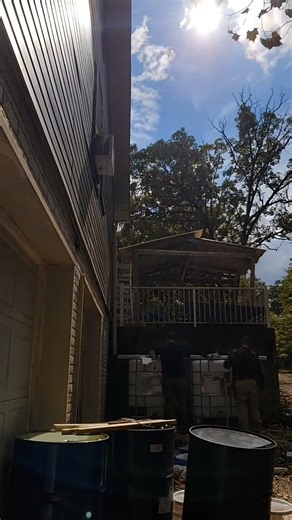 setting up the rain water collection system at the homestead