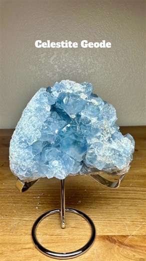 ✨Available✨ Shop The Crystal Vortex on Etsy: https://thecrystalvortexus.etsy.com Celestite Geode on Stand – Elegant Crystal Décor for a Calm & Refined Space Introduce a sense of tranquility and natural sophistication into your home or workspace with this exquisite Celestite Geode displayed on a silver metal stand. Showcasing beautiful sky-blue crystals with a soft, light-reflective sparkle, this piece serves as a timeless focal point that enhances both modern and organic interiors. Ideal for hom