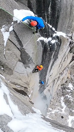 Vertical Ice-Rock Wall—Climbers vs Gravity at the Edge
