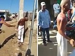 Moment man tied to pole and flogged with rope after rape allegations