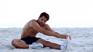 Shirtless Man Stretching On Beach Stock Footage Video (100% Royalty-free) 4114567 | Shutterstock