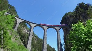 Red train of Bernina on the Landwasser viaduct, Albula - Filisur
