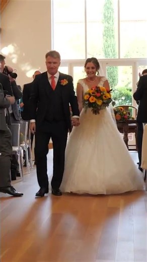 Bride and Groom Walk up the aisle