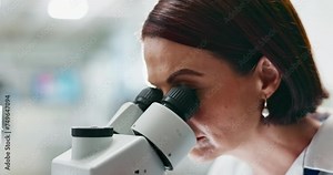 Woman, scientist and forensic study with microscope for science, microbiology or research at lab. Closeup of person or researcher looking in scope or lens for scientific breakthrough or discovery