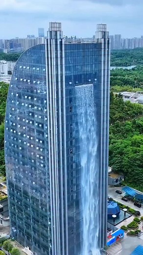 What do you think about the Liebian International Building’s unique waterfall feature? In Guiyang, China, a stunning man-made waterfall cascades 108 meters down the Liebian Building in the city’s central business district. Four powerful pumps push water to the top, creating a breathtaking sight that has amazed residents and visitors alike. . ©️🎥 @mychinatrip . . Comment your thoughts below😍 Tag your friends! . Follow us for more… . Like❤️| Comment💭| Share⚡ 📲 DM for credit or removal. ✅ Turn 