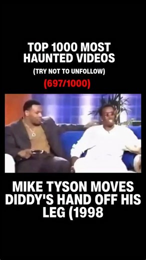 Haunted Footage on Instagram: "In a 1998 appearance on *The Keenen Ivory Wayans Show*, Mike Tyson and Sean “Diddy” Combs shared the couch during a lighthearted interview. While recounting a humorous story, Diddy briefly placed his hand near or on Tyson’s leg. In response, Tyson calmly lifted Diddy’s hand and shifted slightly away, all while maintaining a composed expression. The moment, though brief, sparked speculation among viewerssome interpreted it as Tyson setting a personal boundary, while