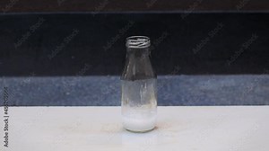 Potassium Permanganate Hydrogen Peroxide Decomposition Reaction. Smoke effect from the chemical reaction of mixing KMno4 and H2O2. Dangerous experiment on black background Stock Video