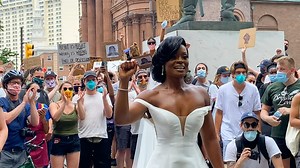 Bride and groom join protest moments before marrying