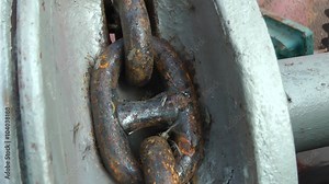 Anchor chain ship moving through the shaft of a ships winch.